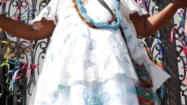 Brazilian woman wearing traditional clothes at Bonfim Church in Salvador, Bahia, Brazil