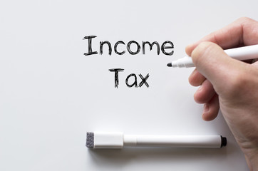 Income tax written on whiteboard