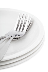 pile of plates and forks