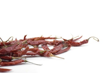 Dry chili pepper isolated on a white background.left corner