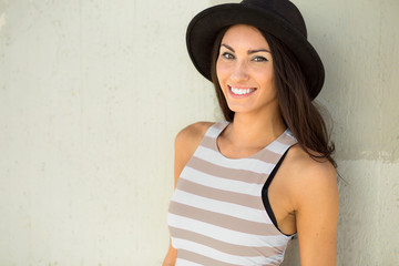 Fun stylish portrait headshot of a young female hipster hip trendy fashion style pretty brunette 
