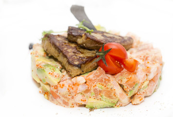salad, fish and eggs decorated with greens and tomatoes