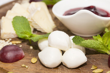 cheese plate with a large decorated the assortment of mint