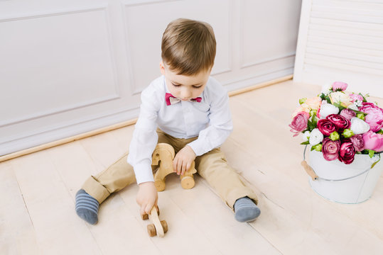 Boy playing while sitting on the floor