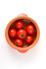 Clay dishes and red tomato