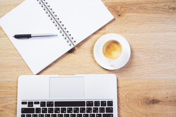 Laptop, coffee and notepad