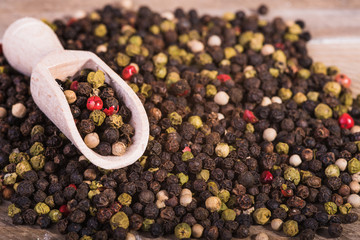 Colored pepper on a wooden background.