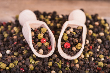 Colored pepper on a wooden background.
