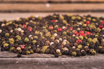Colored pepper on a wooden background.