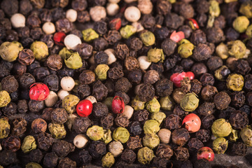Colored pepper on a wooden background.