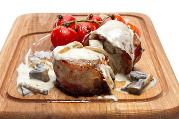 Grilled meat wrapped in bacon