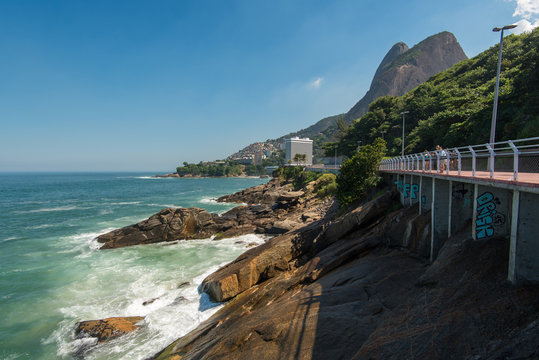 Rocky Coast of Rio de Janeiro with Mountais and Slum Vidigal