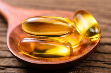 fish oil in wooden spoon