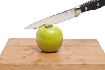 knife cutting apple