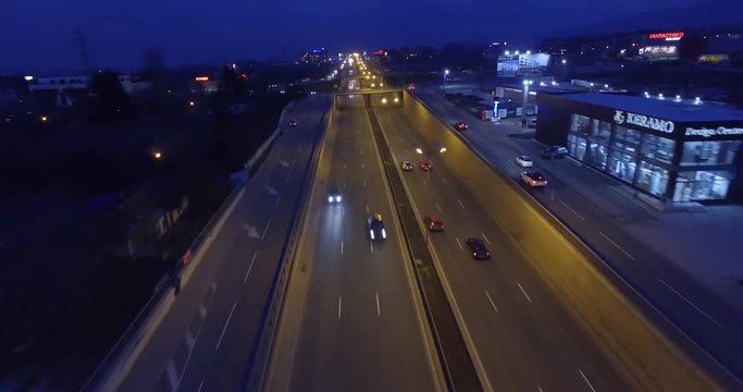 Aerial - Traffic on roundabout and highway at night 