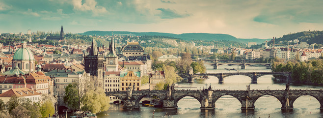 Naklejka premium Prague, Czech Republic bridges skyline with historic Charles Bridge and Vltava river. Vintage