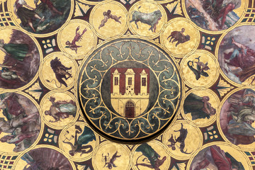 The calendar plate with coat of arms of Prague, Czech Republic. Wallpaper background