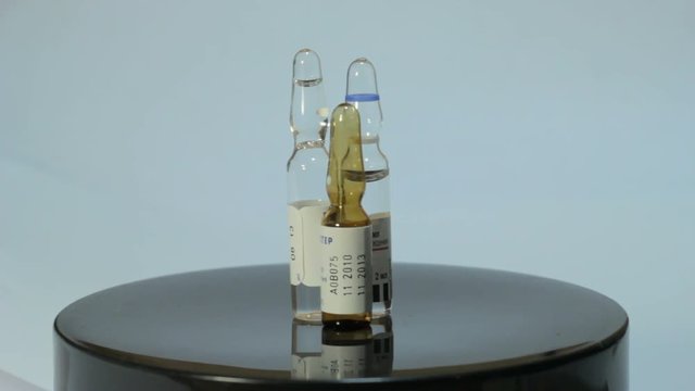 Ampoules rotate on a white background 3