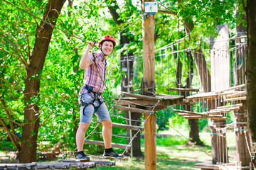 adventure climbing high wire park - people on course in mountain