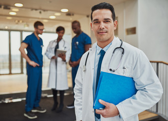 Thoughtful young Hispanic doctor in a hospital