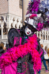 Fototapeta na wymiar Beautiful carnival mask on San Marco square in Venice, Italy