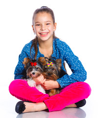 Girl playing with her yorkshire terrier