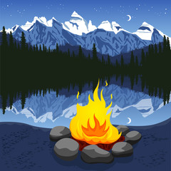 Campfire with stones near mountain lake reflecting night sky