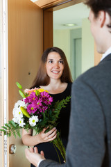 Girl giving flowers and gift