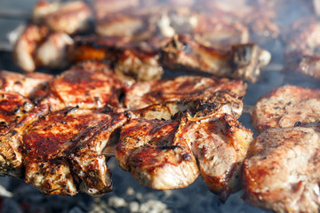 Cooking meat on the fire.
