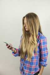 Close up portrait of beautiful blonde woman with plaid shirt sen © Susana Valera