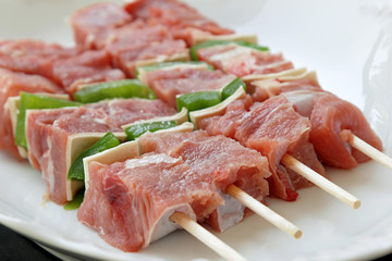 Shashliks with pork, cheese and peppers