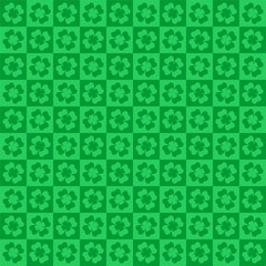 Green background for St. Patrick's Day green from dark and light squares with green four leaf clover in tile in a row alternately and under each other