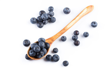 Fresh blueberries in wooden spoon