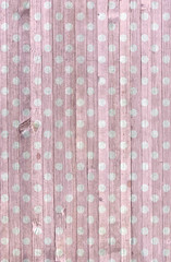 faded pink and white polka dot weathered wood background