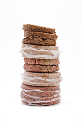 minced meat arranged on top of each other over plain white background.