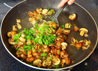 Fried mushrooms in a frying pan