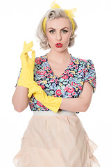 Worried fifties housewife with sink plunger, humorous concept, s