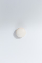 French colorful macarons on white background