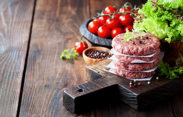 Raw ground beef meat burger steak cutlets, selective focus
