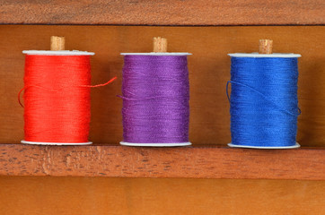 Threads on wooden box