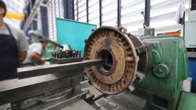 Metal working lathe a in factory. Machining process in the factory for repair induction motor cover plate 