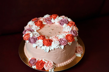 Birthday cake with red roses.