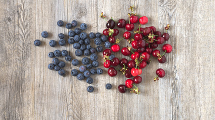 Berries on a wooden table in natural light
