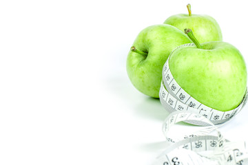 green apple with Measuring tape on white background 