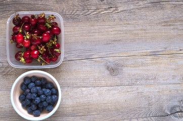 Berries on a wooden table in natural light