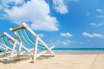 canvas beach bed on the beach with nice sky and cloud