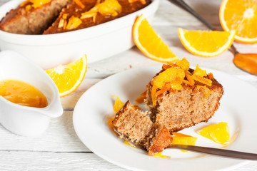 a piece of orange pie on the white plate