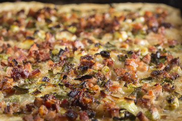 Homemade pizza with bacon and green onion