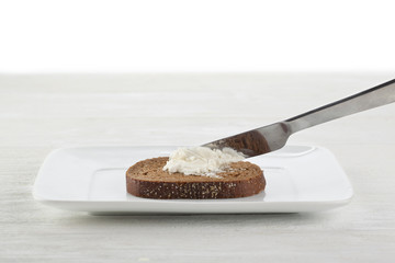 spreading butter on chocolate bread