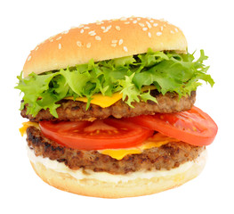 Double cheeseburger with lettuce and tomato in a sesame seed bread roll